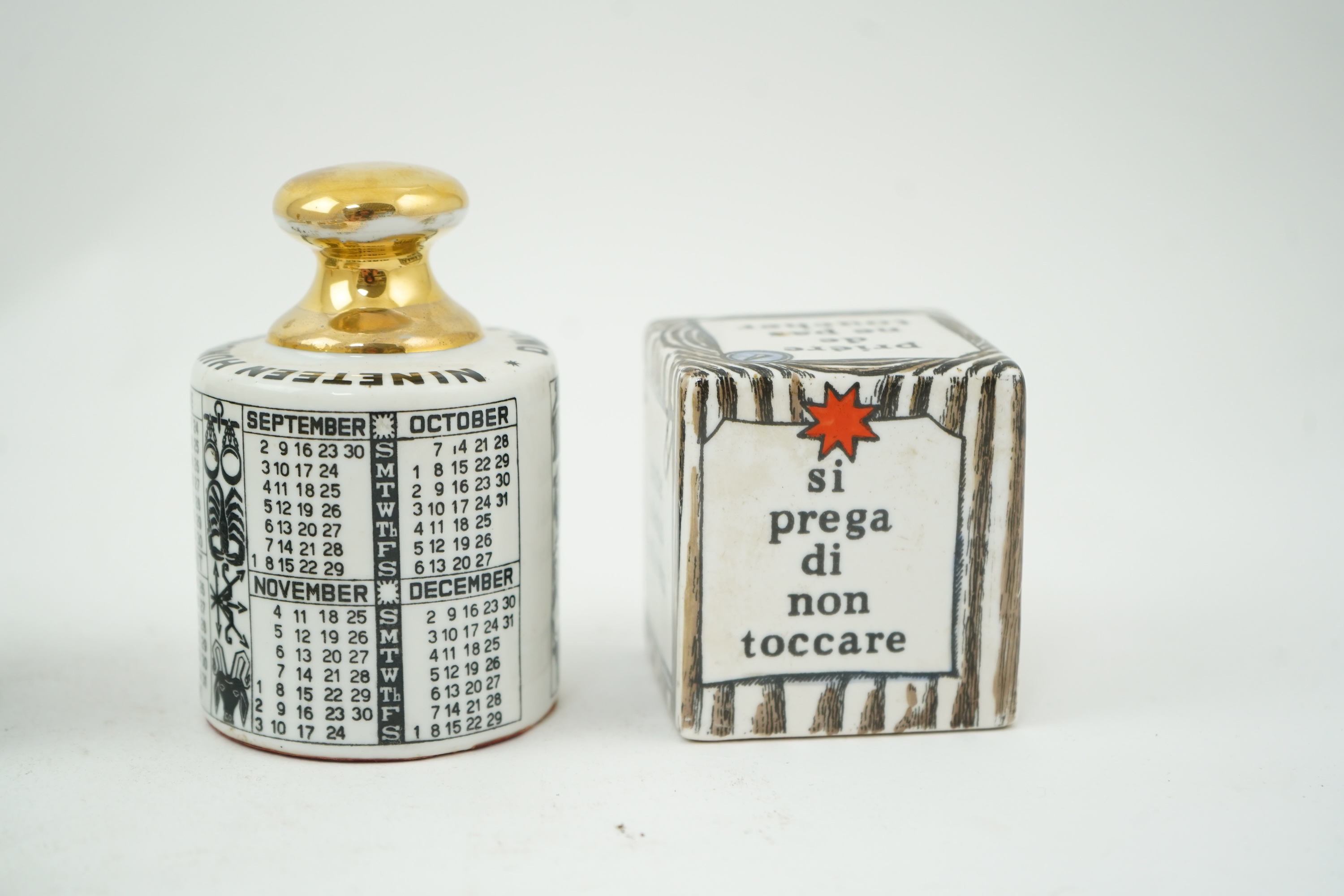 Piero Fornasetti (Italian, 1913-1988): A collection of Fornasetti desk items and dishes